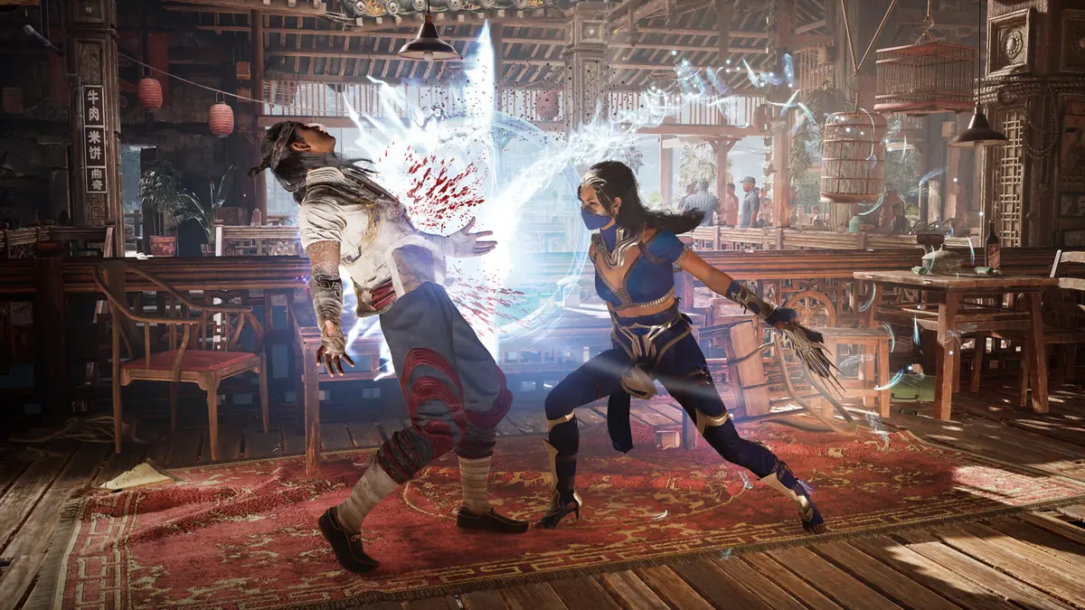 Official Mortal Kombat 1 screenshot of two fighters trading blows in an indoor arena