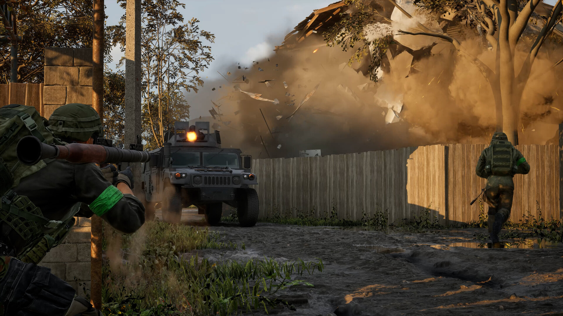 Official WARDOGS screenshot of a soldier firing a rocket launcher at an armoured vehicle as a building collapses in debris